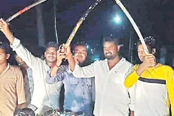 Youngsters with swords during birthday celebrations in Mummidivaram