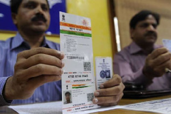 AP postal Department linking mobile number with Aadhar at door step