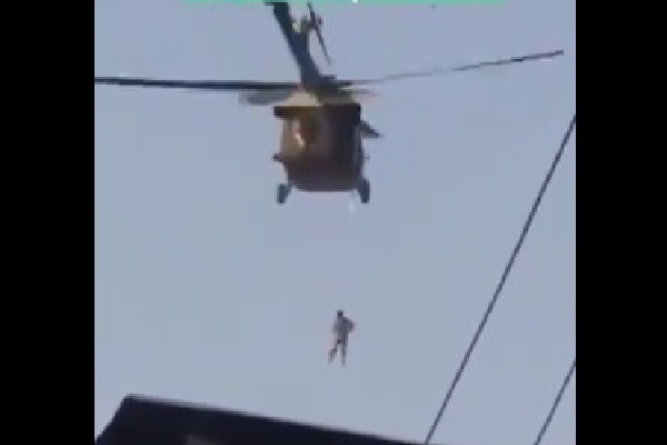 Taliban helicopter raid with hanging a human body