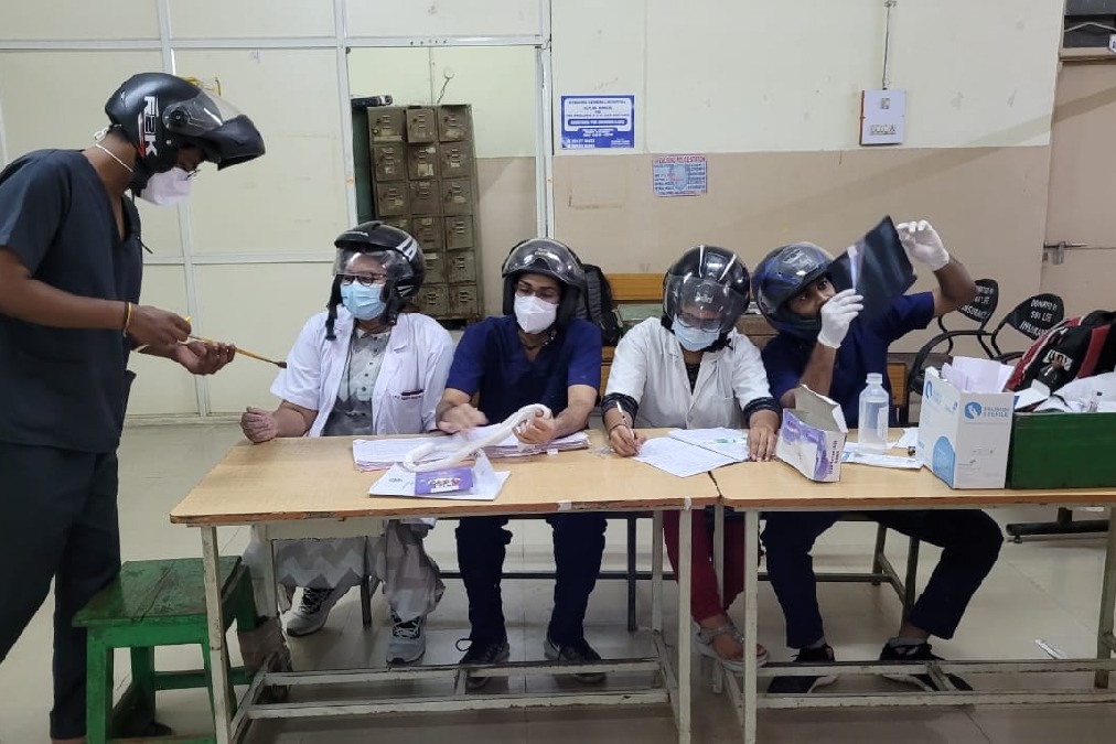 Junior doctors at Hyderabad's Osmania Hospital wear helmets