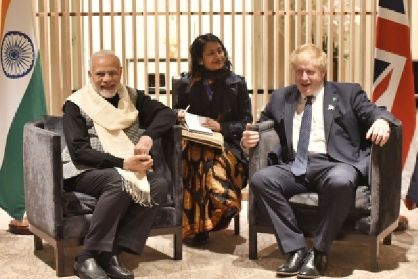 Modi meets Boris Johnson on the sidelines of COP26