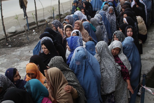 Under Taliban regime poor Afghan women beg at bakeries to feed children