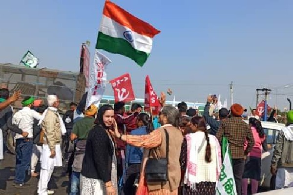 Farmers celebrate as they leave their protest site Kaushambi 