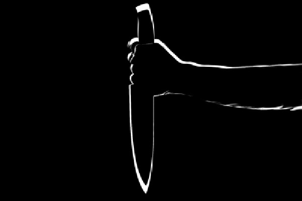 Man surrenders after stabbing wife in public view
