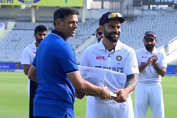 Virat Kohli felicitated with a special cap by India coach Rahul Dravid 
