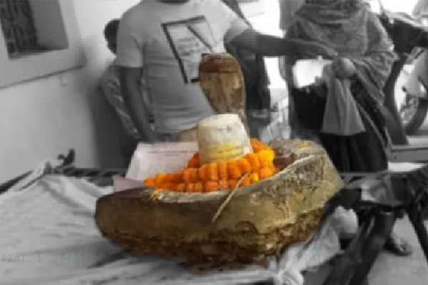 Shivling of a temple uprooted and carried on a hand cart to the Tehsil office to appear before a Court  