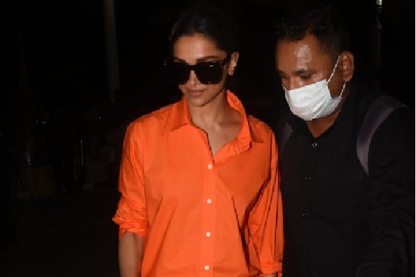 Deepika Padukone returns from Hyderabad seen at airport in orange look with sunglasses