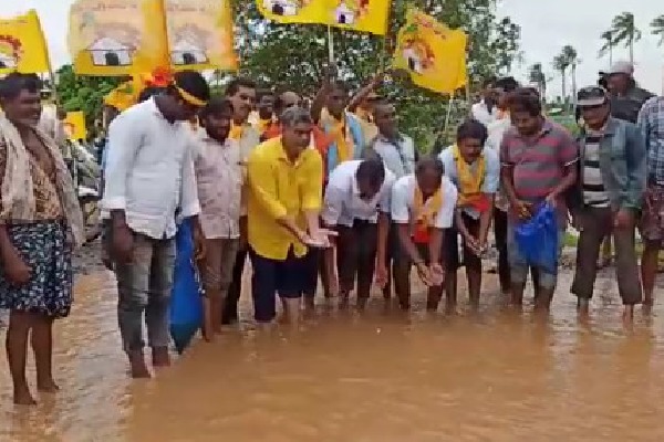 TDP Leaders protests on water logged roads in Kaikaluru constituency