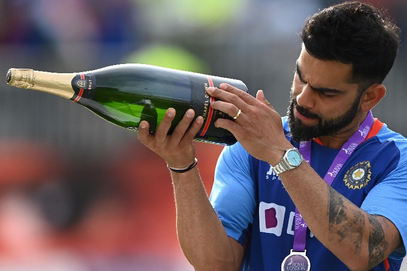 a photo of virat kohli with Champagne bottle goes viral on social media