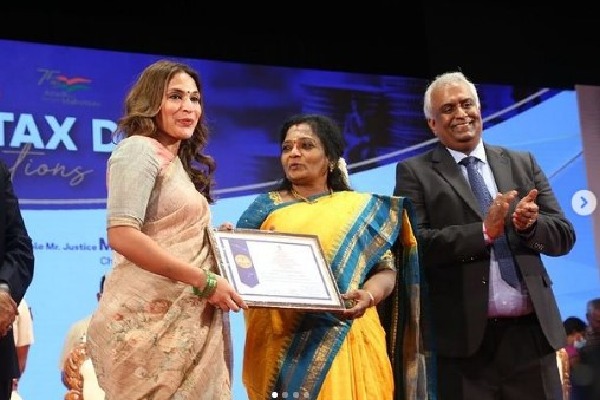 Rajinikanth honoured by Income Tax Department Aishwaryaa Rajinikanth accepts award