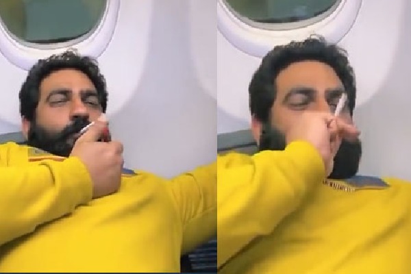 Video of a man smoking on plane goes viral 