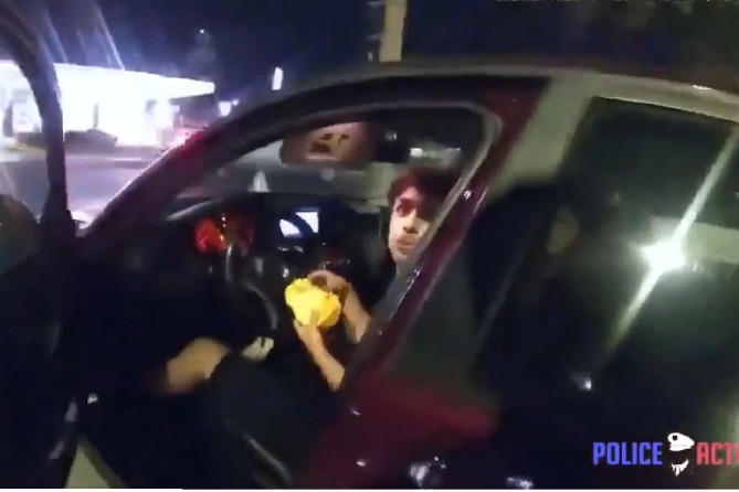 US teen eating burger in car shot by Cop