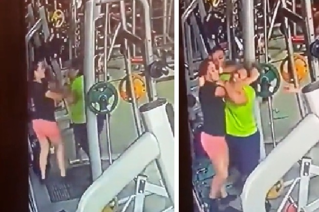 Women slap each other over gym equipment