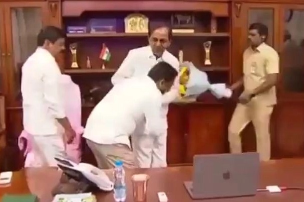 Telangana official triggers row by touching CM's feet