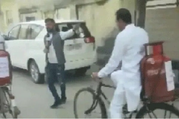 WITH GAS CYLINDER ON BICYCLE CONGRESS MLA REACHES POLLING BOOTH