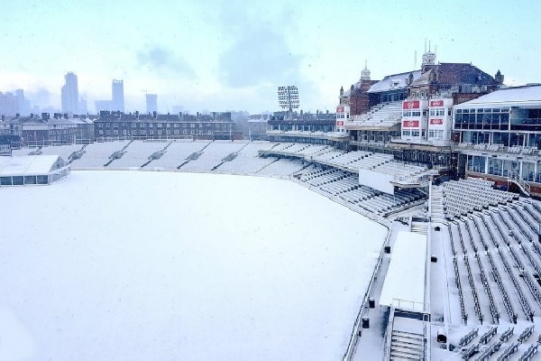 Oval cricket ground filled with snow