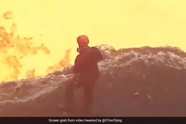 Man Stands At The Edge Of A Lava Ocean In Hair Raising Video