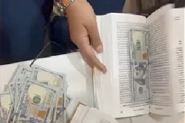 90000 us dollors Stuffed In Books Found At Mumbai Airport