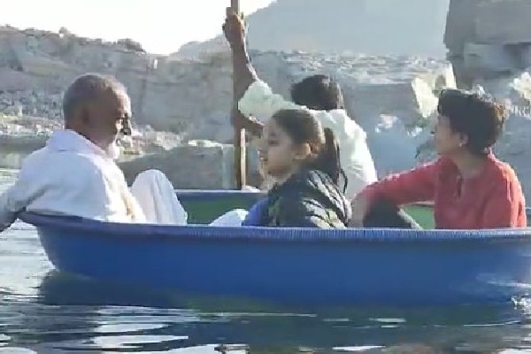 Raghuveera sails with his granddaughter in a coracle 