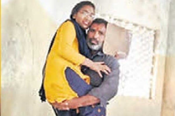 Father carried his daughter on shoulders to exam hall