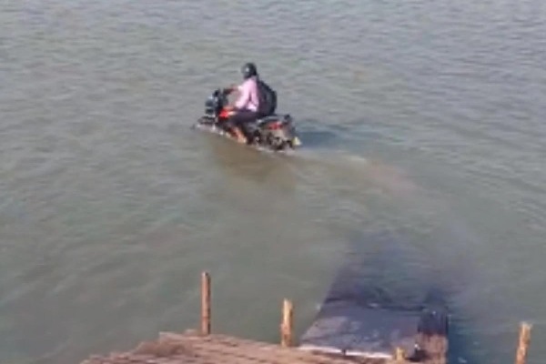 Video of man riding motorcycle in a river goes viral