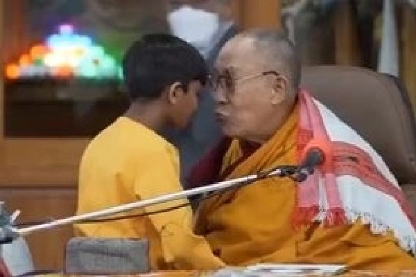 Dalai Lama 'caught' on video kissing boy on lips
