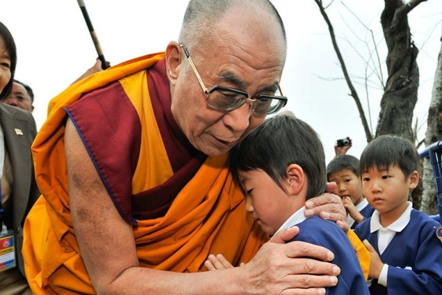 Dalai Lama apologises to boy, his family