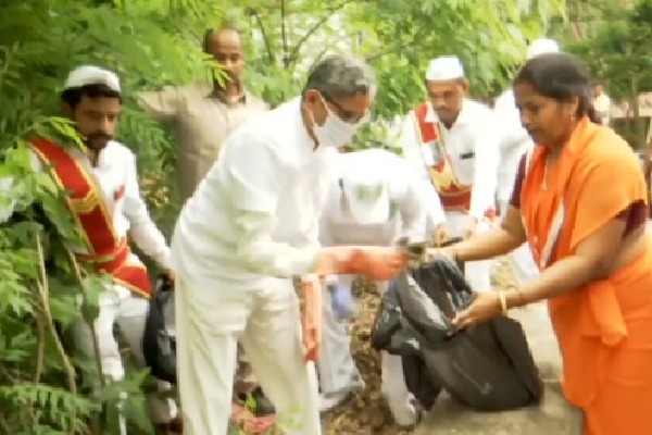 Former CJI NV Ramana cleans garbage at Tirumala ghat road 