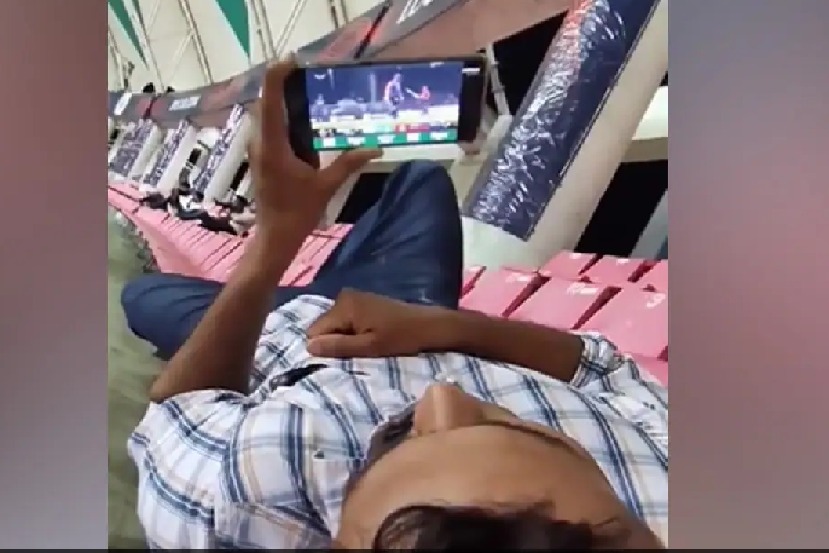 Man Watches IPL Match On His Phone Inside Cricket Stadium