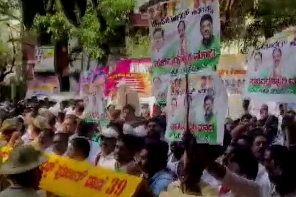 Congress MLA Sudhakars supporters protest outside Siddaramaiahs residence 