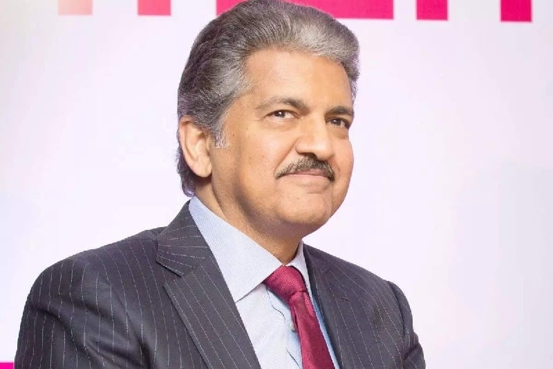 Anand Mahindra shares video of men waiting for cars to splash water on them