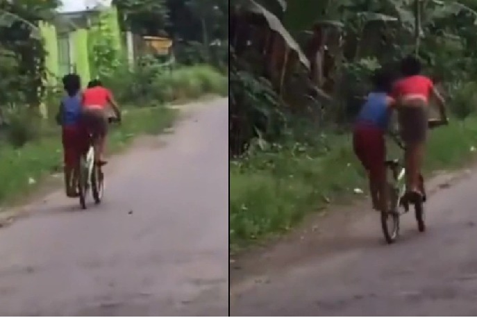 Adorable video of two boys riding a bicycle in a funny way will make you giggle viral vedio