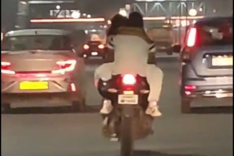 Ghaziabad police reacts to couple romance on moving bike
