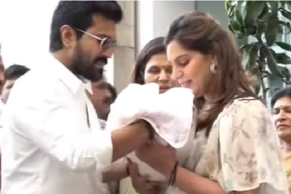 Ramcharan and Upasana before media with new born baby