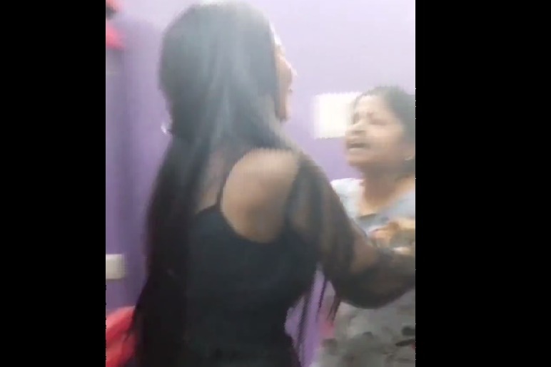 A Mother beats her daughter for having a boyfriend