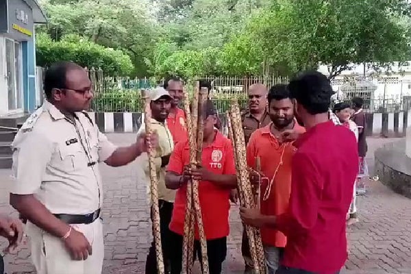 Telugudesam Party reacts on TTD decision of hand sticks to pilgrims 