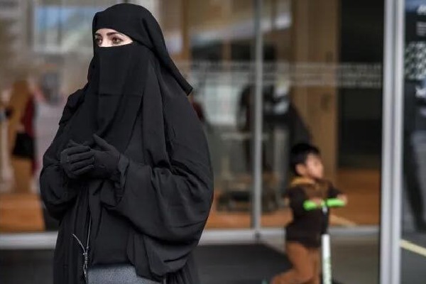 Swiss parliament approves ban on burqas sets fine for violators
