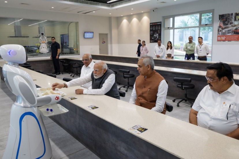 PM Modi enjoyed a cup of tea served by Robots