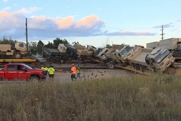 Train carrying military equipment derails in US
