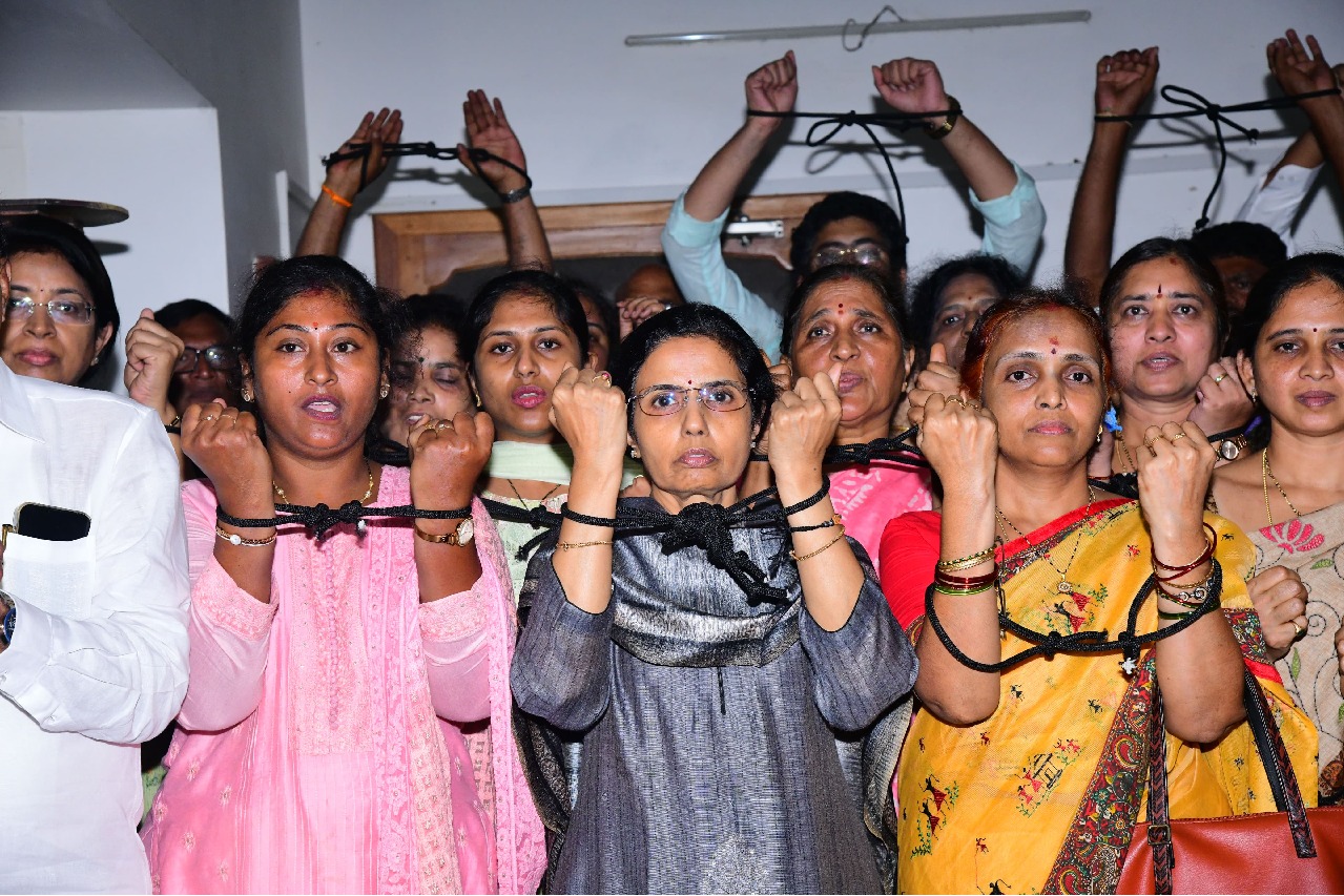 Nara Bhuvaneswari protests by tying her hands with rope