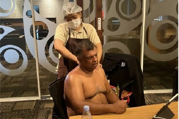 Air Asia CEO Tony Fernandes shirtless during board meating