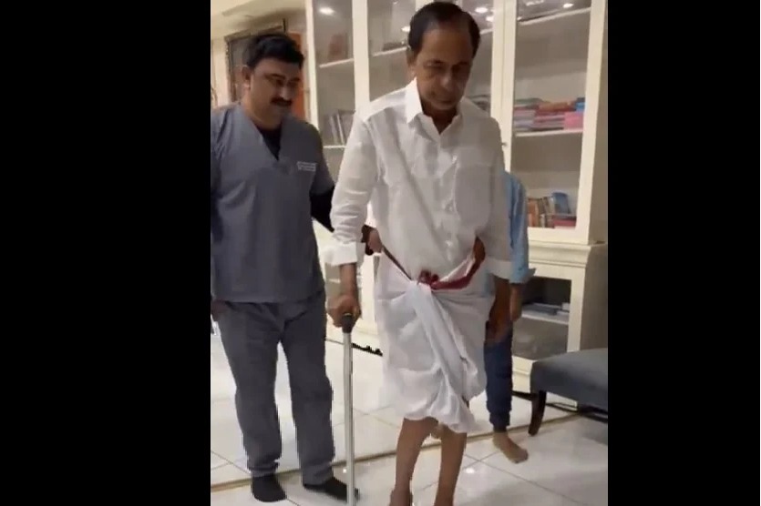KCR walking with stick in his house