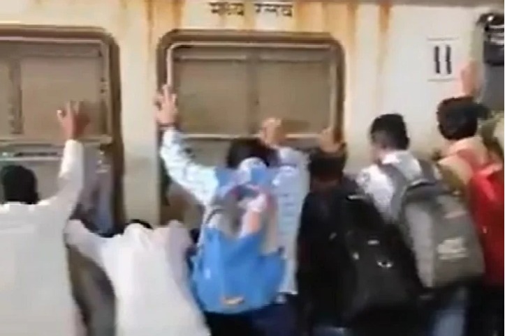 Passengers push Mumbai local train coach to save man