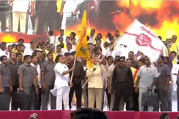 Chandrababu waves Janasena flag and Pawan Kalyan waved TDP flag