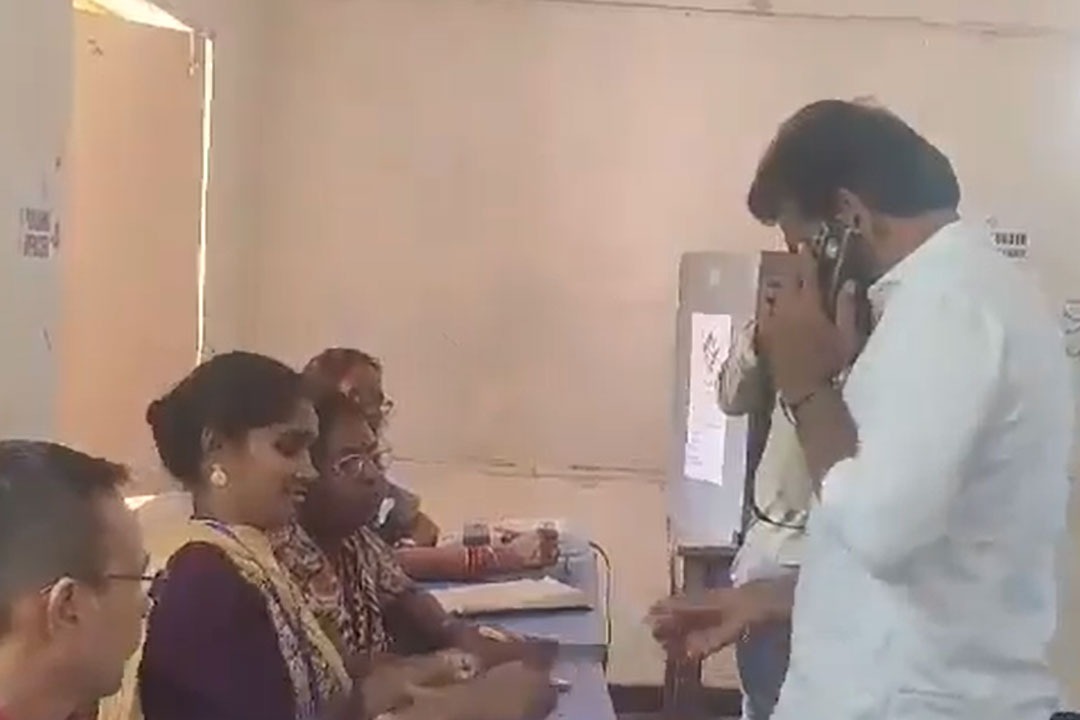 YCP candidate Duvvada Srinivas cast his vote while talking in mobile