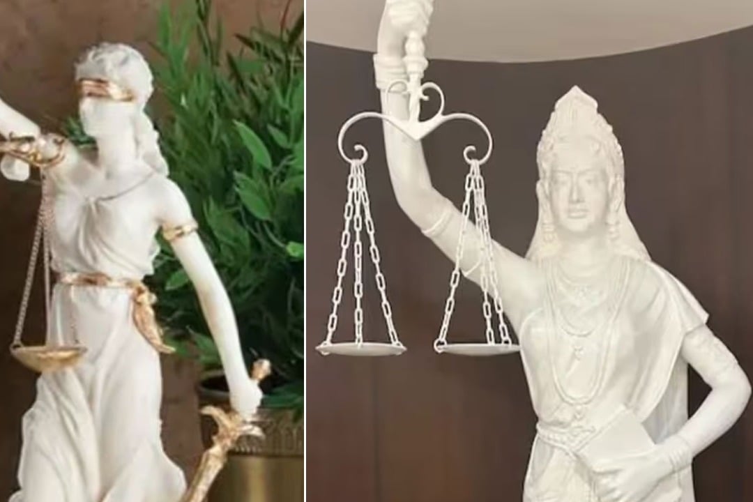 blindfold of statue of Lady Justice has been removed and the sword replaced with Constitution