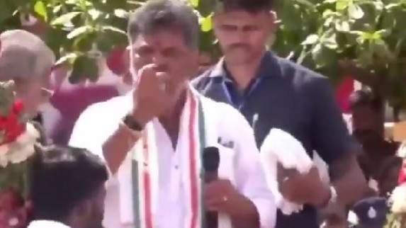 DK Shivakumar throws half eaten apples at people netizens angry