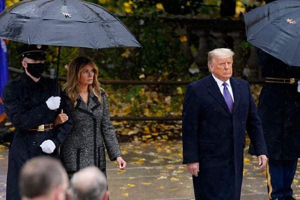 Melania Trump walks with soldier