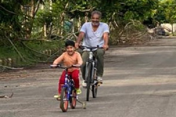 Prakash Raj cycling with his family members at farm house