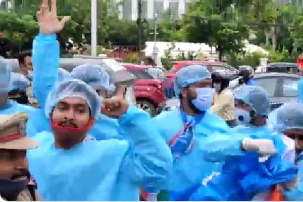NSUI cadre wearing PPE Kits protests at Pragathi Bhavan